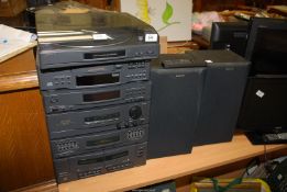 A Sony stacking Stereo, remote and speakers.