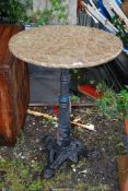 Cast Iron based Pub table with concrete rotating top, 23" diameter x 29 1/2" high.