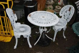 A White painted Aluminium patio table with two chairs, 27" diameter x 26" high.
