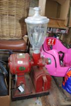 A vintage Hobart coffee grinder in red.