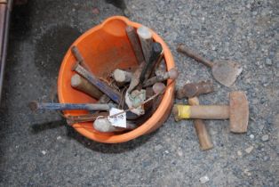 A quantity of chisels and lump hammers.