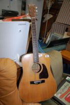 A six string Acoustic Guitar, Ibanez.