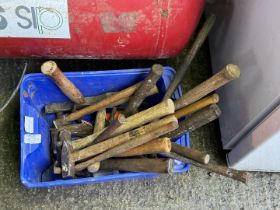 A box of hammers, and trowels.