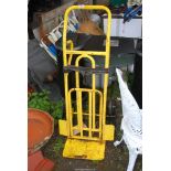 A yellow step walker sack truck.