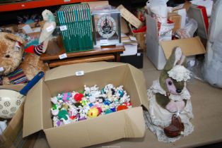 A box of Disney 101 Dalmation toys, nest of three tables, stone parrot, etc.