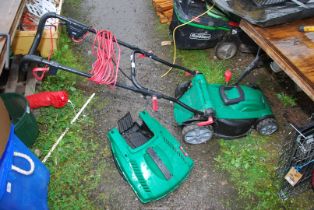 A Qualcast electric mower with grass box.