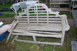 A wooden garden bench, a/f, 65" wide x 41" high.