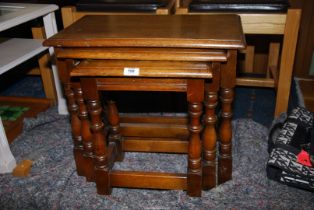 An Oak nest of three tables.