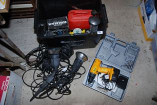 A 12 volt "Driver" cordless Drill, lights, fuel can, etc.