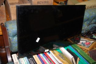 A Sony flatscreen TV model "KD:L 32WD 754".