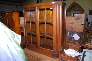 An Oak glass fronted floor standing display cabinet, 3' wide x 39" high x 11" depth.