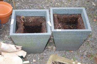 Two plastic planters, 13" square x 13 1/2" high.