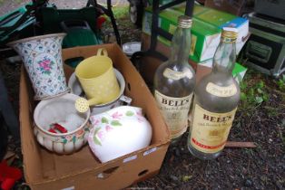 Two Bells whiskey bottles, a chamber pot, vases and small watering can.