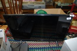 A flatscreen TV, LG model 28 TK420S-PZ.