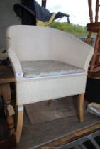 A Lloyd Loom style commode.