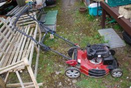 A Titan 196cc overhead valve engine Mower, self-propelled with grass box (good compression).