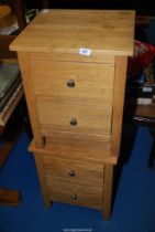 A pair of Oak Bedside Cabinets.