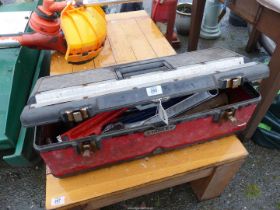 A toolbox containing large stilsons, bolster chisels, lump hammer, combination spanners etc.