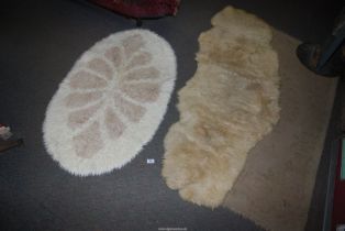 A double sheepskin rug and a faux sheepskin rug.