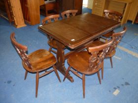 A dining table - extending and 6 chairs, closed 28" x 45" x 29", opens to 69".