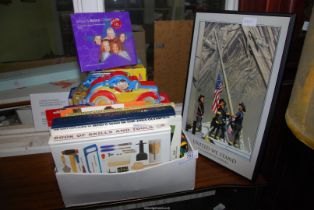 Children's books and a print of 9-11 heroes.