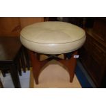 A beige topped G-Plan style Stool, 17 1/2'' high x 20'' diameter.