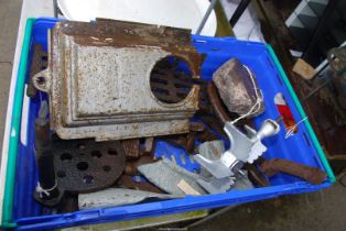 A crate of cast iron items including fire front, old hammer heads etc. ***V.A.T.