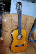 A six string Acoustic Guitar, Prince model C425.