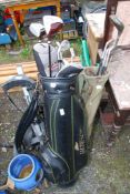 A quantity of golf irons, Palmer and Jemon and golf trolley and bags.