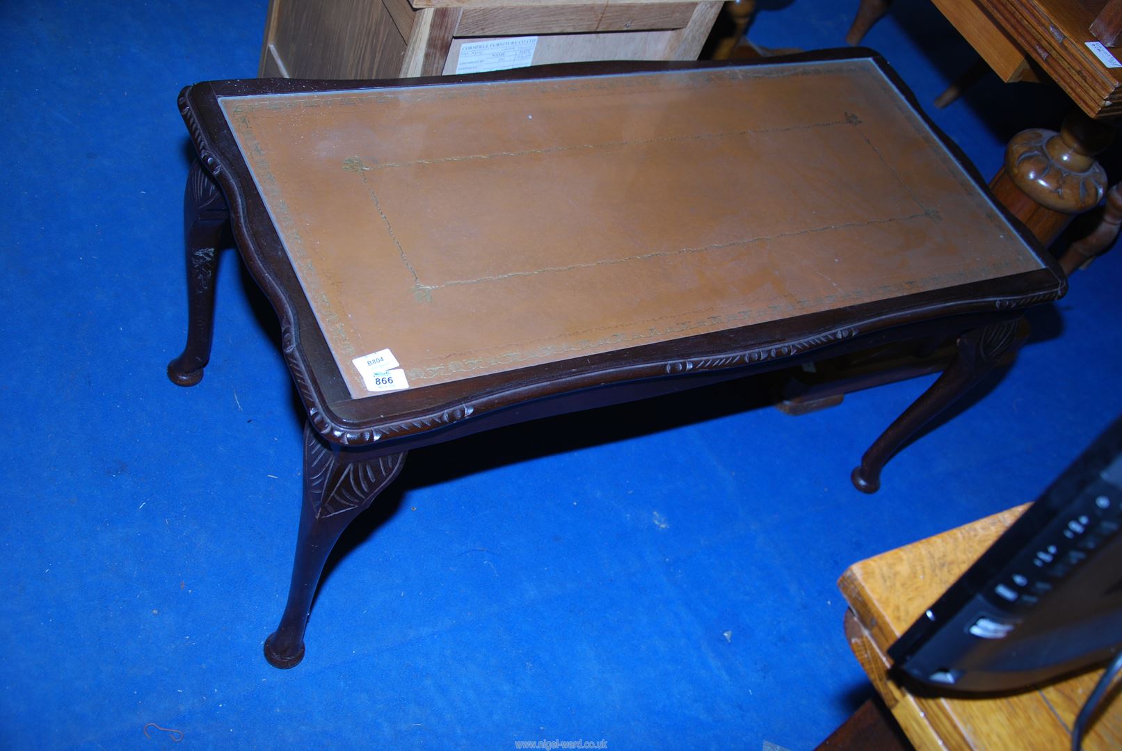A Mahogany framed leather glass topped coffee table.