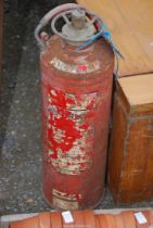 A vintage water filled fire extinguisher.