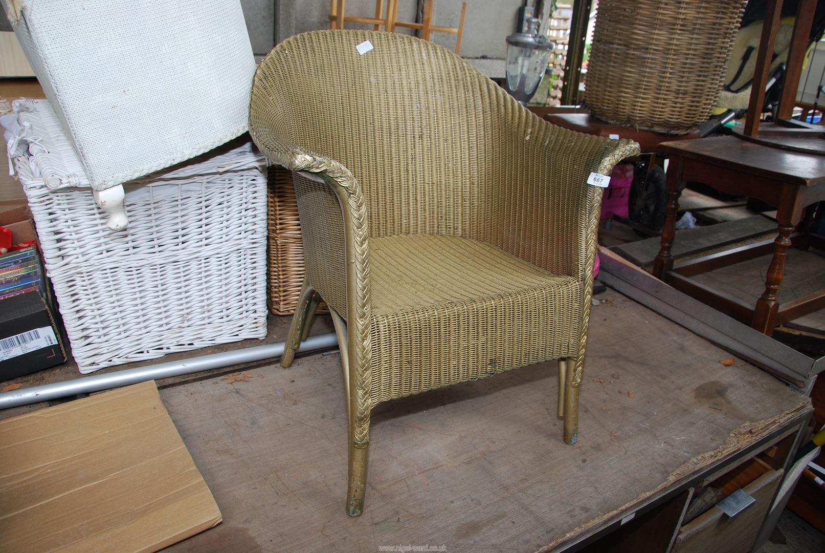 A gold painted Lloyd Loom style chair.