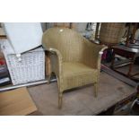 A gold painted Lloyd Loom style chair.