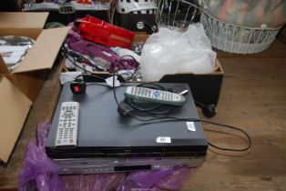 A DVD player and Samsung VHS & DVD recorder.