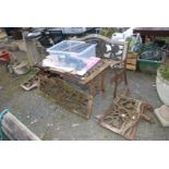 A garden table and bench with cast iron centres, in need of restoration plus a mitre saw.