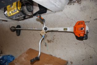 A Stihl strimmer with bump feed, good compression.