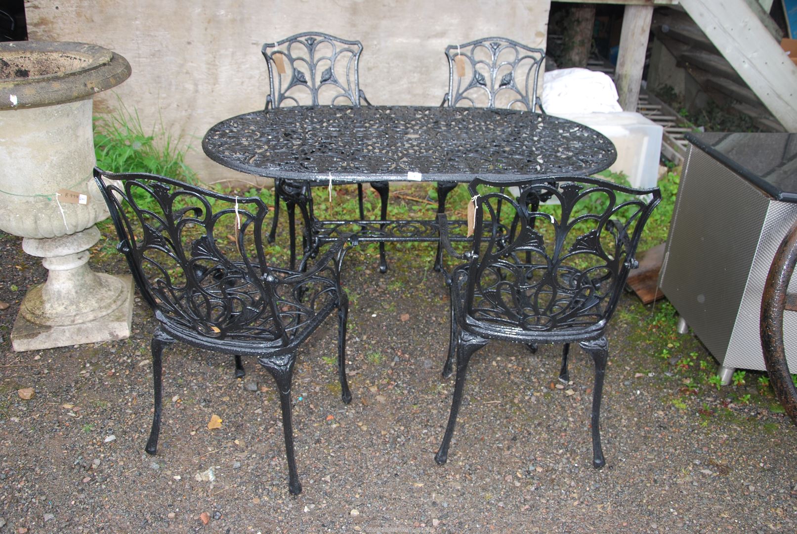 A black painted Aluminium decorative patio Table, 55" wide x 28" high and four chairs. - Image 2 of 2
