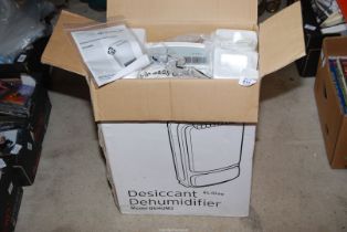 A Rotary Desiccant Dehumidifier DEHUM 3 with instructions.