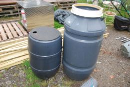 Two water butts with taps.