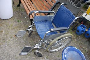 A fold up Wheelchair, on large wheels.