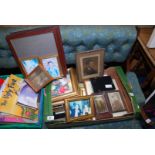A box of pictures and frames.