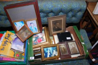 A box of pictures and frames.