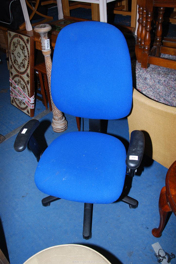 A blue office/typists chair.