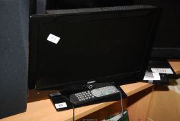 A small flatscreen TV by Digihome with built-in DVD player, with remote.