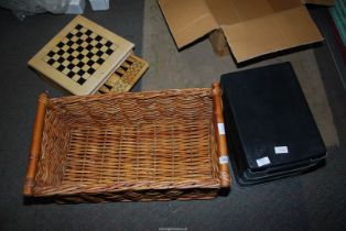 A wooden set of board games, wicker basket, plastic drawers etc.