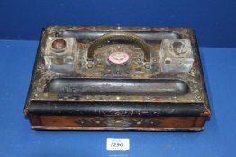 An ebonised double Standish/Inkstand with two glass ink bottles having pink china plaque,