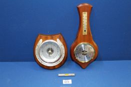 Two small barometers including Weathermaster and a small spirit level.