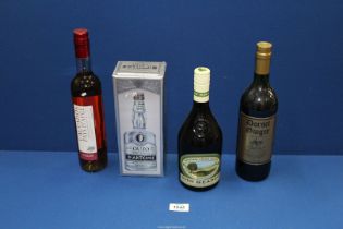 Four bottles including Calvados, Irish Meadow Liqueur, Ouzo and Dorset Ginger.