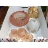 Three glass lamp shades and a pink glass dressing table set.
