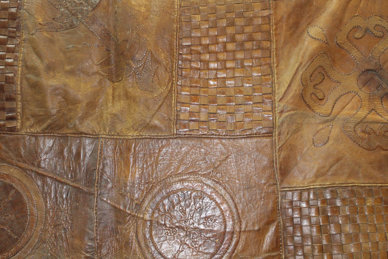 A large leather patchwork style rug having woven and palm tree panels and fringing. - Image 4 of 4